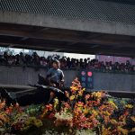 Man waves at crowd at Panagbenga flower festival 2015.