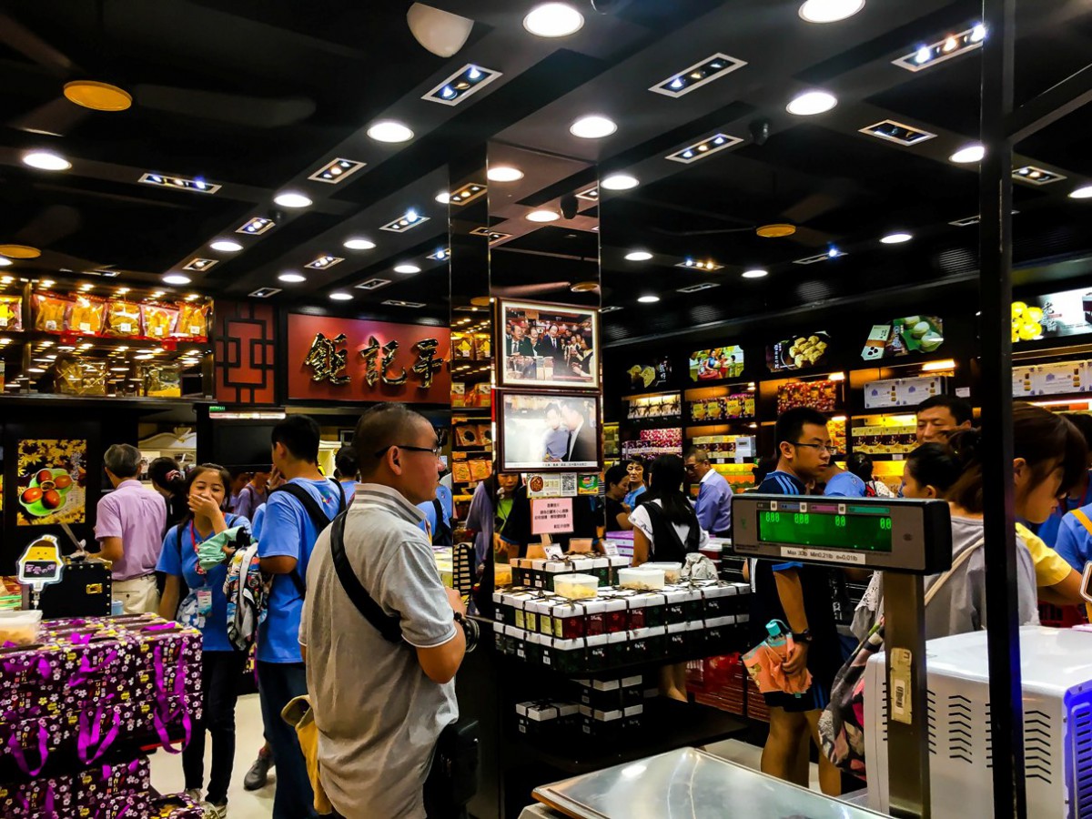 Tourists looking around in Koi Kei Bakery